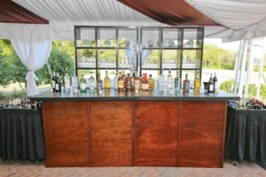 Erin's Family was all about the bar so Snyder Event Rentals mahogany bar & shelves were perfect!