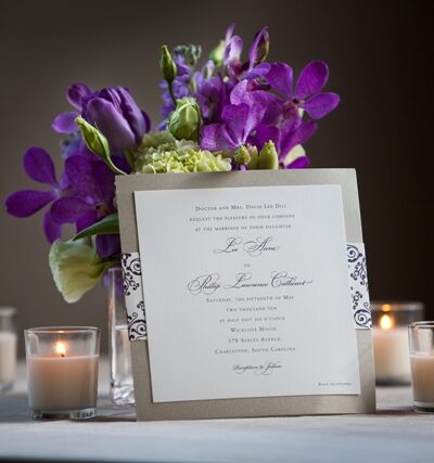 Wedding invitation with flowers and candles.