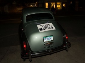 Vintage car with "Just Married" sign displayed.