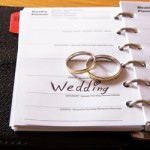 Wedding rings on calendar planner page.