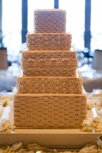Tiered wedding cake with basketweave design.