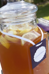 Glass jar filled with lemon iced tea.