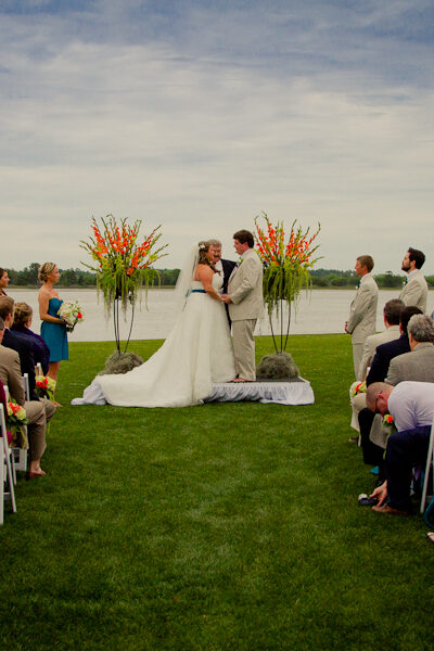 Outdoor wedding ceremony by the waterfront.