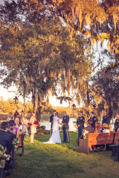 Outdoor wedding ceremony by a lakeside.