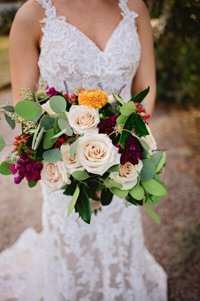Elegant bridal bouquet with roses and greenery.