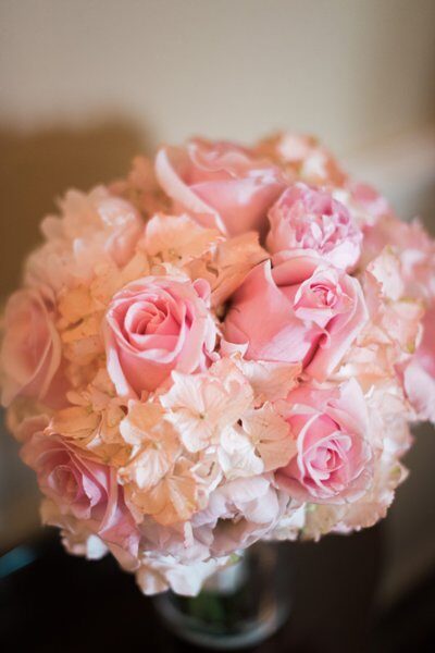 A bouquet of soft pink roses and delicate hydrangeas.