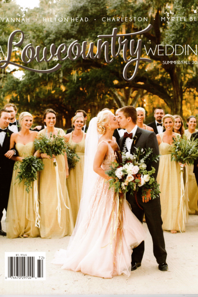 Bride and groom walking happily with their wedding party outdoors.