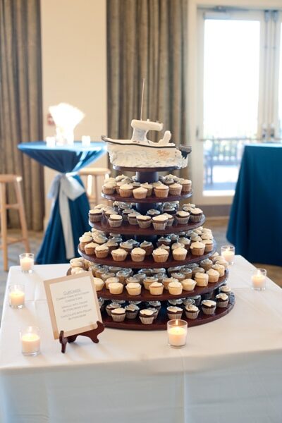 Elegant cupcake tower centerpiece at an event venue.