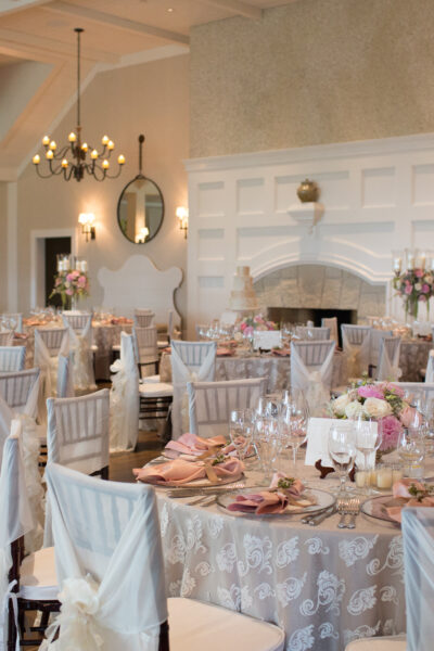 Elegant wedding reception setup with soft lighting and floral decor.