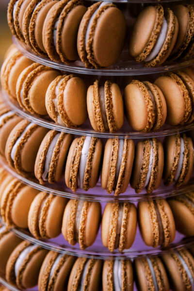 A tower of golden brown macarons arranged in concentric circles.
