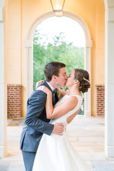 Bride and groom sharing a kiss on their wedding day.