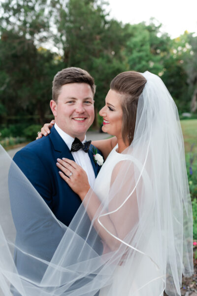 A joyful bride and groom sharing a moment on their wedding day.